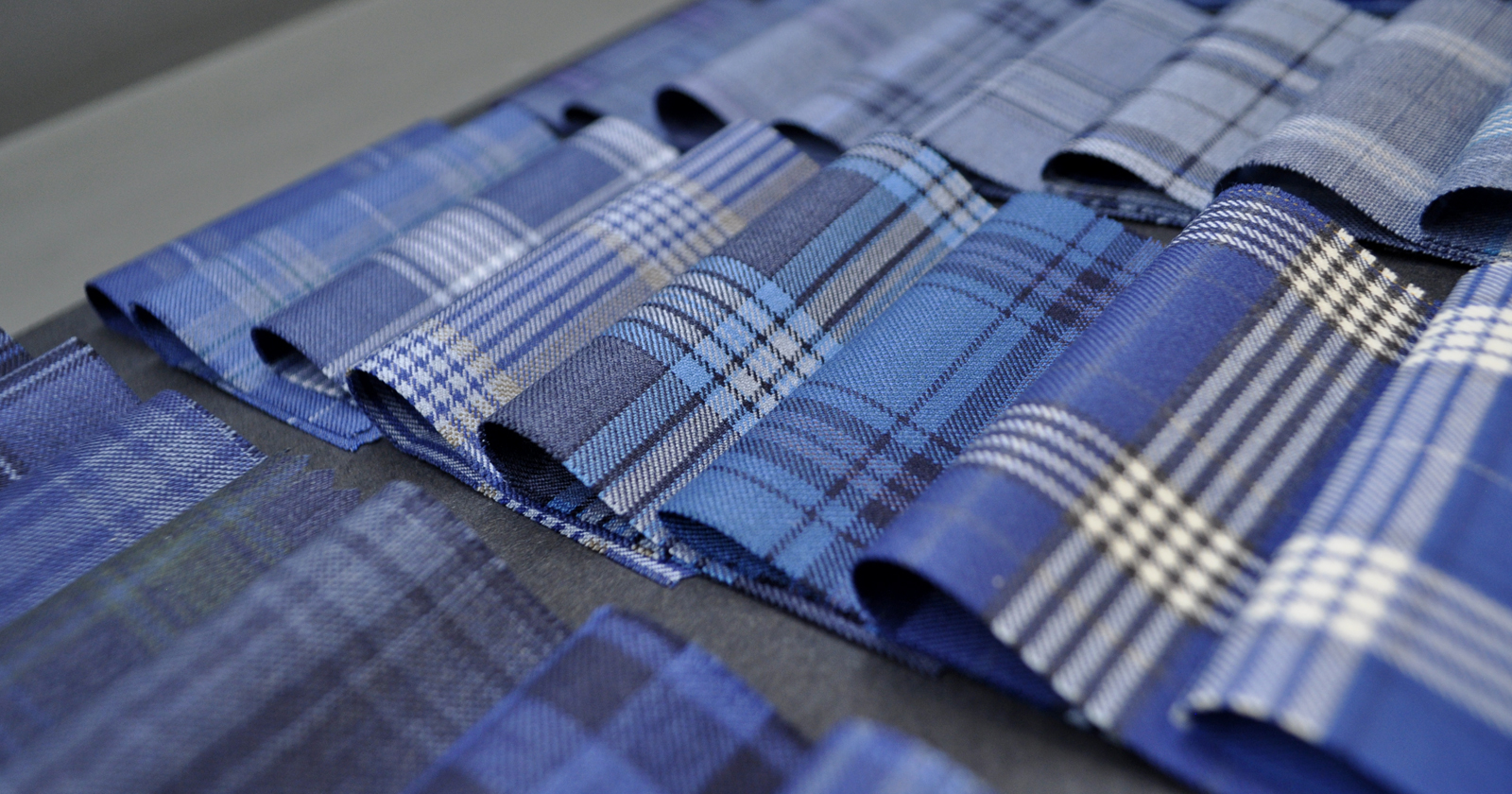 Several fabric samples in shades of blue.